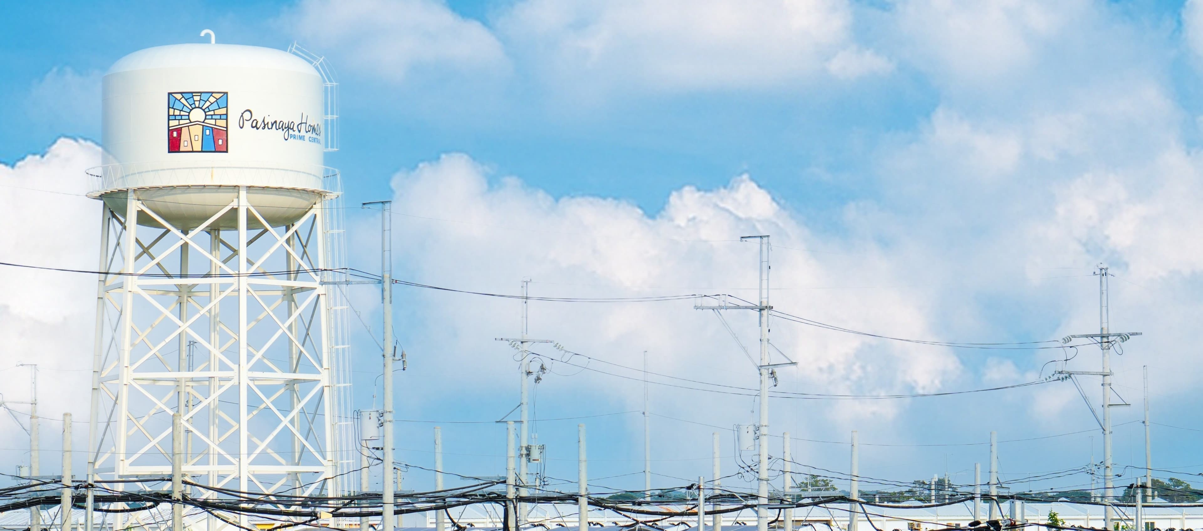 Water tower and electricity distribution lines at Pasinaya Homes Prime Central