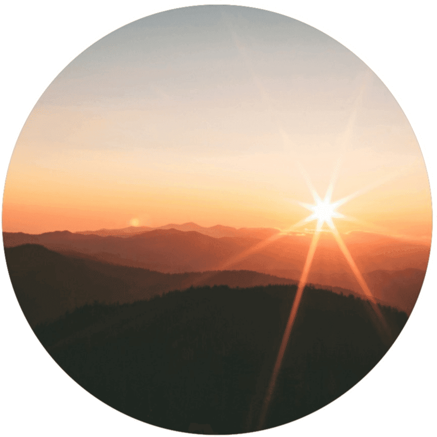 Sunlight rising over mountain ridges